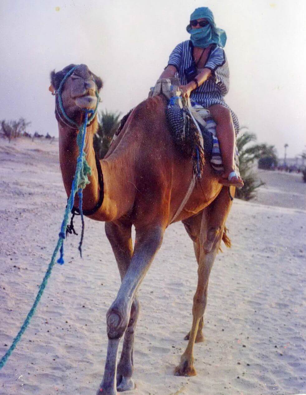 Riding Camels in Desert