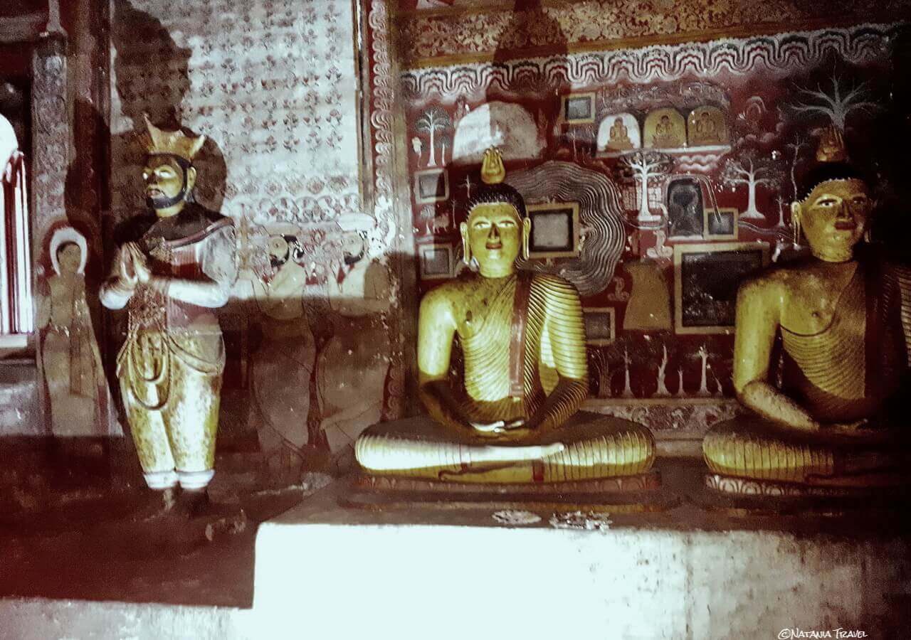 a Statue of the King Nissanka Malla and Buddha Statues Dambulla Cave 2