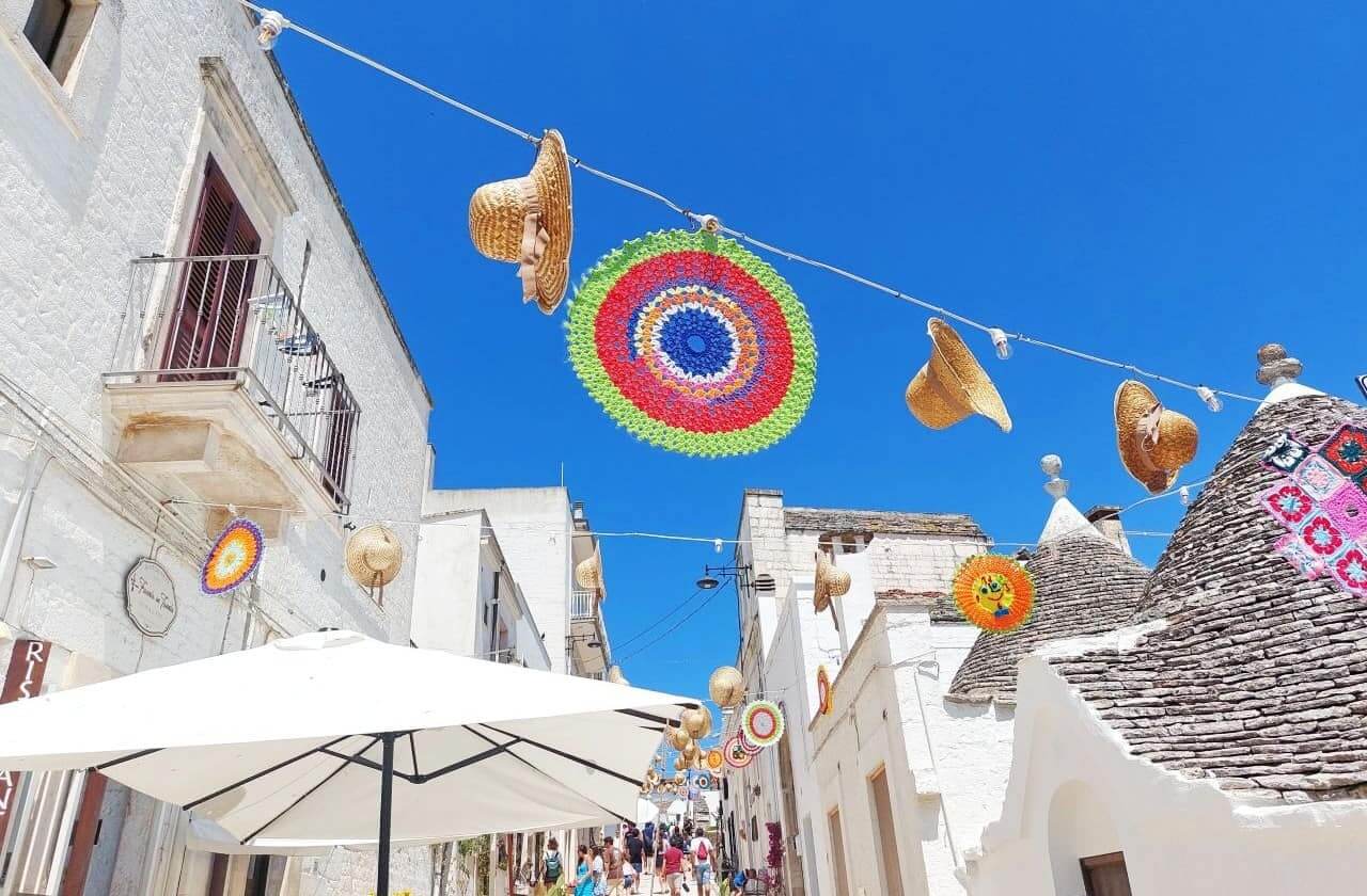Alberobello, Via Brigata Regina with colourful hats