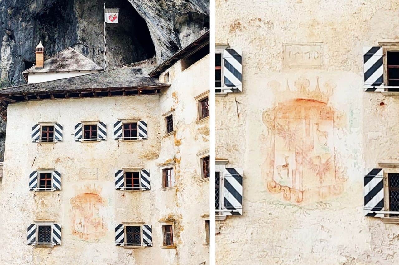 The coat of arms of the Cobenzl family from 1570 on the Predjama Castle wall